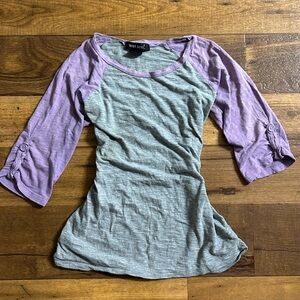 Im selling a grey and purple 3/4 sleeve shirt from wet seal